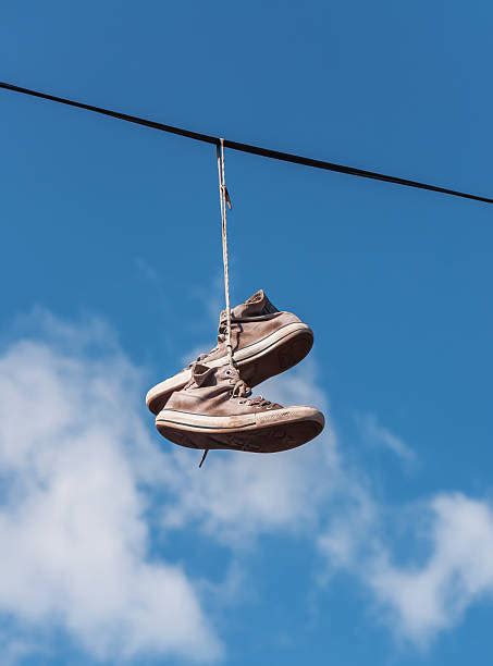 trainers hanging on wires